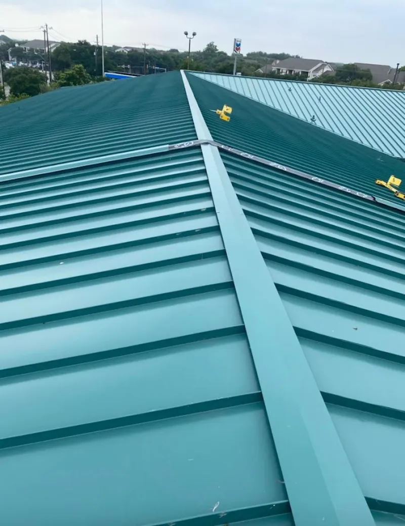 Green commercial metal roof ridge and valley for Metal Roof Repair in Oakville